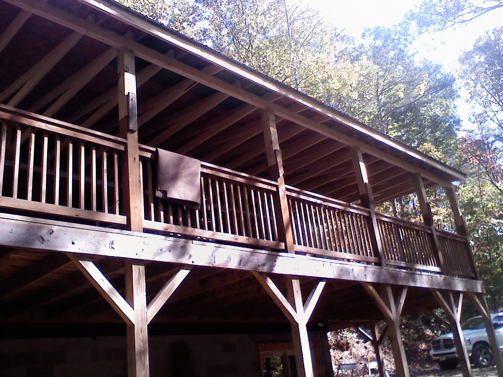 Timber framing under a new elevated porch and deck — Roof Leak Repair in West Newbury by Roofing Brothers